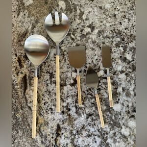 Salad Servers 2-Piece Matte Steel Rattan matching rattan cheese serving set.